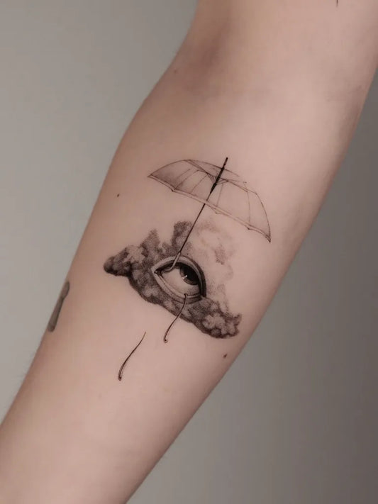Medium Black and Grey Umbrella Cloud Eye Tattoo on Women Arm by @viktoria.wagenhals