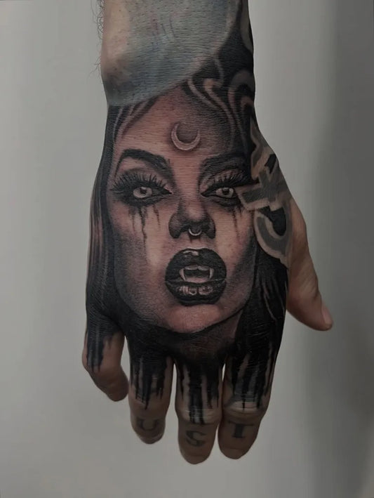 Medium Black and Grey Vampire Woman Horror Tattoo on Women Hand by @dbartattoos