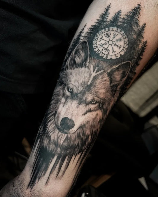 Medium Black and Grey Vegvisir Wolf and Forest Tattoo on Men Arm by @lowenn.art