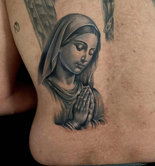 Medium Black and Grey Virgin Mary Praying Tattoo on Men Back by @eastsideringwood