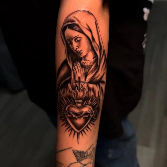 Medium Black and Grey Virgin Mary Sacred Heart Tattoo on Men Arm by @eqm.art