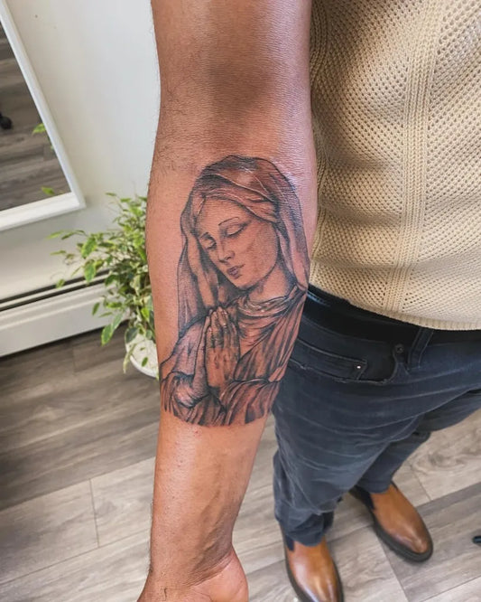 Medium Black and Grey Virgin Mary Tattoo on Men Arm by @homegrown.ink