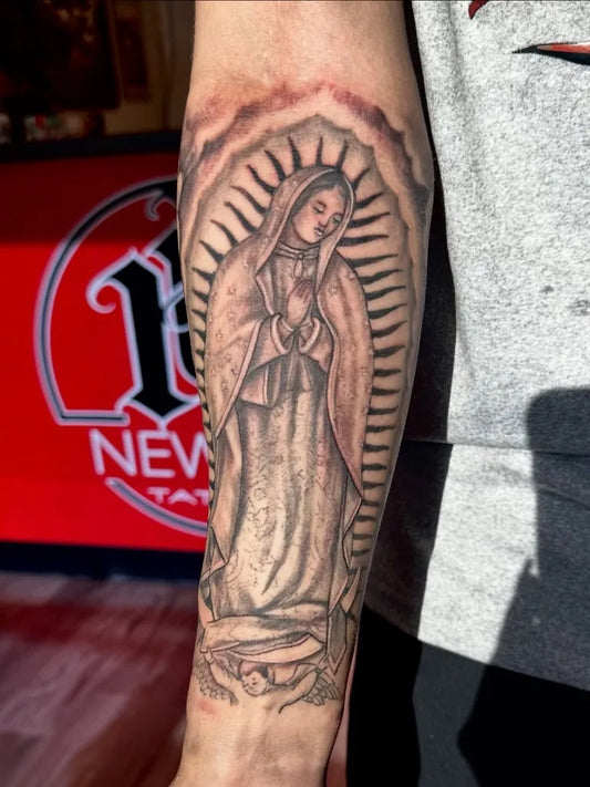 Medium Black and Grey Virgin Mary Tattoo on Men Arm by @newinktattoowa