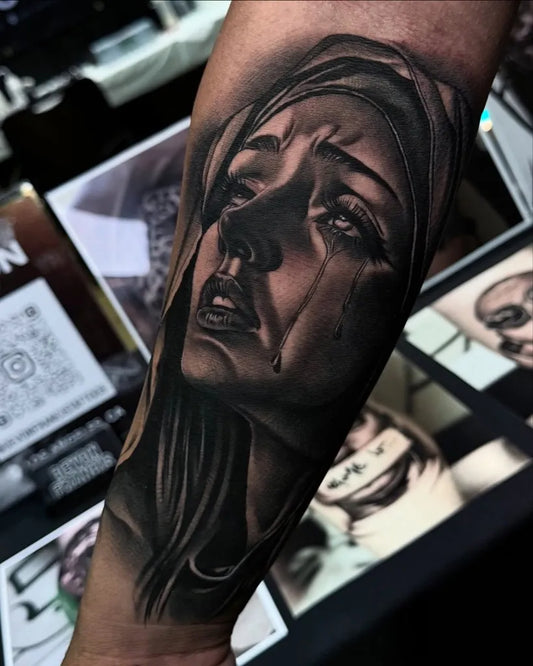 Medium Black and Grey Virgin Mary Tattoo on Women Arm by @devonfrancistattoos