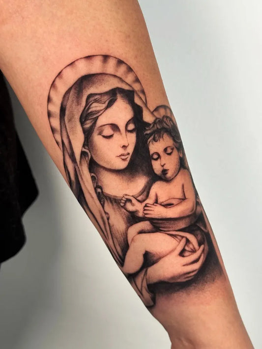 Medium Black and Grey Virgin Mary with Child Tattoo on Women Arm by @meltingheartstattoo