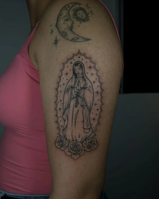 Medium Black and Grey Virgin Mary with Moon and Roses Tattoo on Women Arm by @inkby.isa