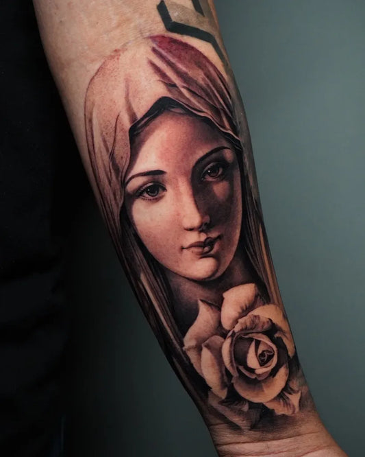 Medium Black and Grey Virgin Mary with Rose Tattoo on Men Arm by @reyr1tattoo