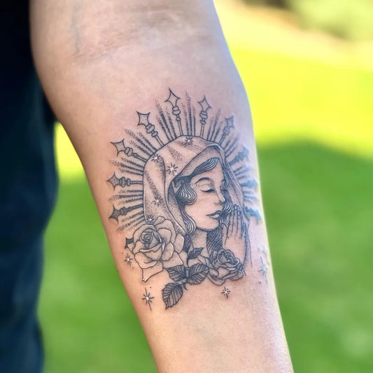 Medium Black and Grey Virgin Mary with Roses Tattoo on Women Arm by @_starla_21
