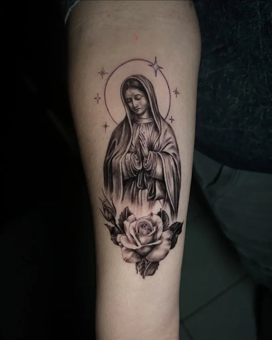 Medium Black and Grey Virgin Mary with Roses Tattoo on Women Arm by @cristianrincontattoo
