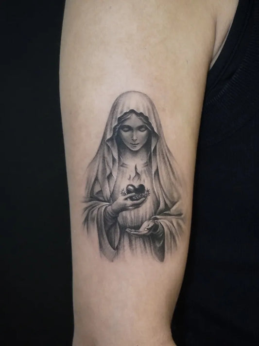 Medium Black and Grey Virgin Mary with Sacred Heart Tattoo on Women Upper Arm by @wtf.jian.tattoo
