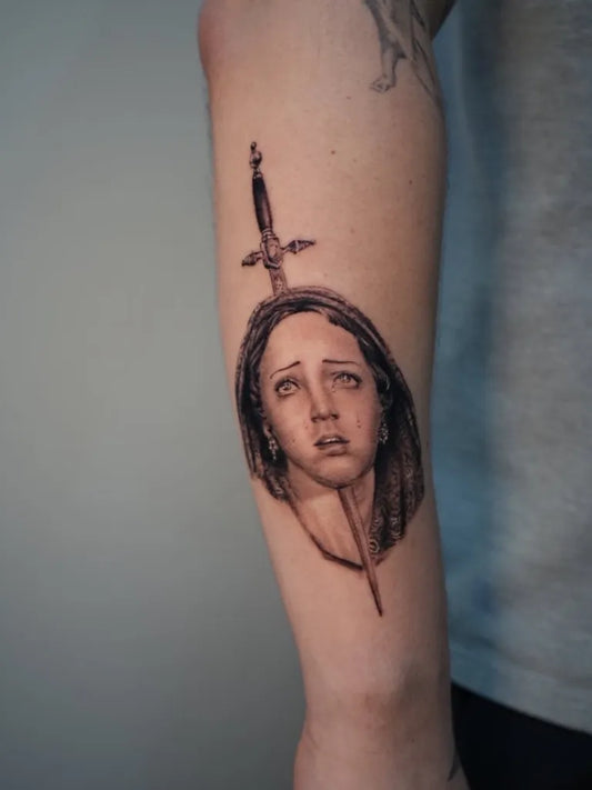 Medium Black and Grey Virgin Mary with Sword Tattoo on Women Arm by @inkmortalredbank