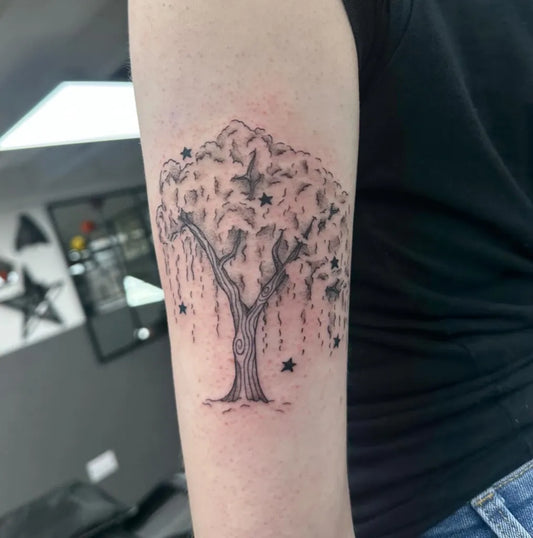 Medium Black and Grey Weeping Tree with Stars Tattoo on Women Arm by @s0ph_ink