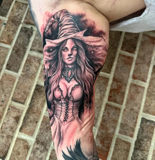 Medium Black and Grey Witch Tattoo on Women Bicep by @mythicalmarkings