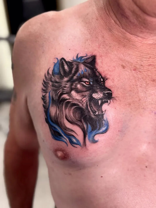Medium Black and Grey Wolf Head on Men Chest Tattoo by @misscherrybombtattoos