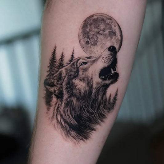 Medium Black and Grey Wolf Howling at Moon and Trees on Men Arm Tattoo by @hoa._.tattoo