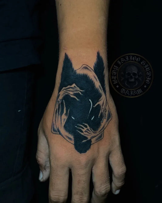 Medium Black and Grey Wolf Shadow Hands on Women Hand Tattoo by @wedytattoo_official