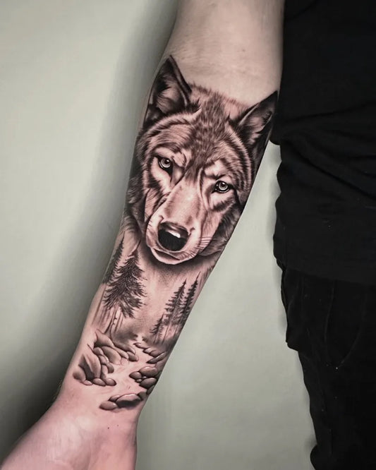 Medium Black and Grey Wolf and Forest Men Arm by @laura_jean_tattoo