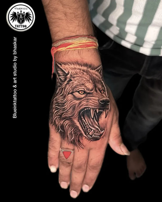 Medium Black and Grey Wolf on Men Hand Tattoo by @blueinktat2