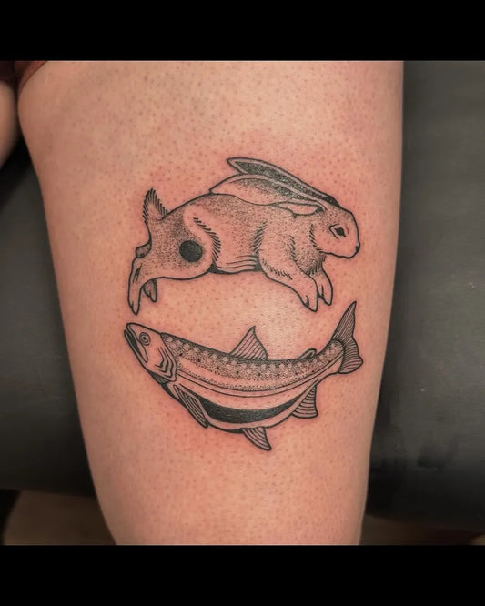 Medium Black and Grey Yin Yang Fish and Rabbit Tattoo on Women Thigh by @liv.laeta.tattoo