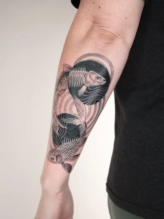 Medium Black and Grey Yin Yang Koi Fish Tattoo on Women Arm by @captainshade.tt