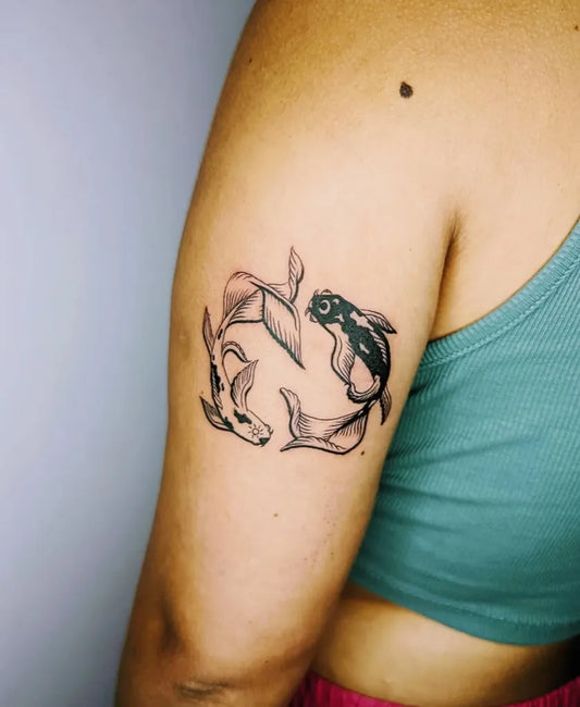 Medium Black and Grey Yin Yang Koi Tattoo on Women Arm by @ediebea