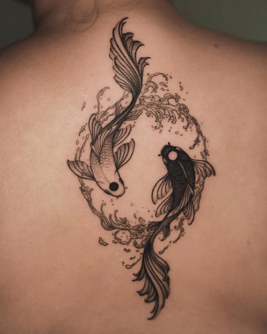 Medium Black and Grey Yin Yang Koi Tattoo on Women Back by @lama_del_ray