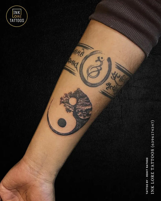 Medium Black and Grey Yin Yang with Band and Text Tattoo on Women Arm by @inkloretattoosglobal