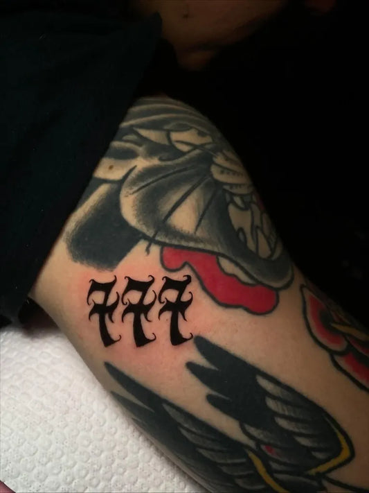 Medium Blackwork 777 Symbol Tattoo on Men Arm by @ra7a.siete