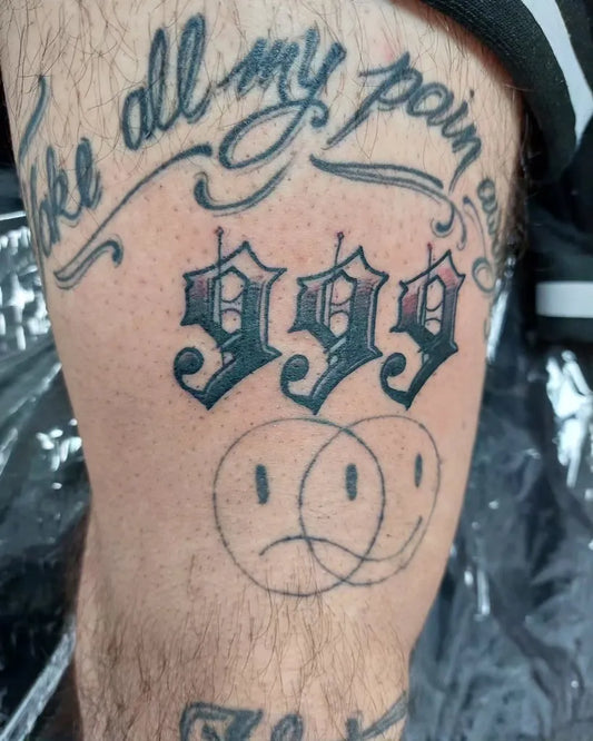 Medium Blackwork 999 Script and Smiley Faces Tattoo on Men Thigh by @urban_boxstudio