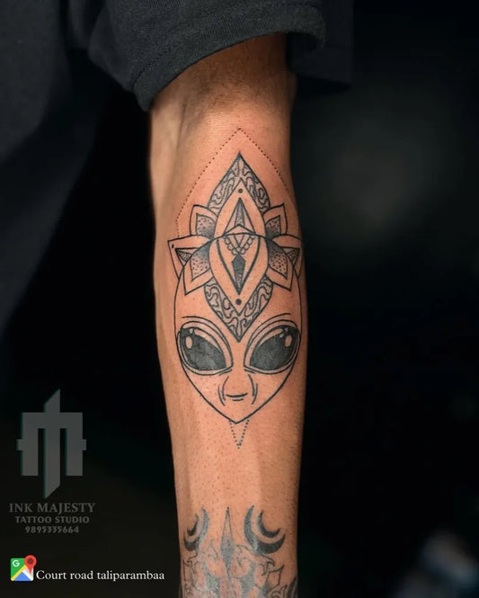 Medium Blackwork Alien Mandala Tattoo on Men Arm by @inkmajestytattoo