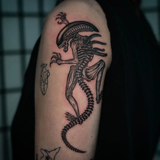 Medium Blackwork Alien Tattoo on Men Arm by @leighkeith.tattoo