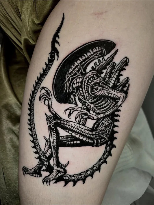 Medium Blackwork Alien Tattoo on Women Thigh by @kizao.art