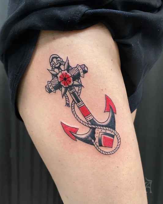 Medium Blackwork Anchor Cross Tattoo on Women Thigh by @atelier.piercingandtattoos
