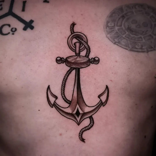 Medium Blackwork Anchor Tattoo on Men Chest by @emy.tattoo