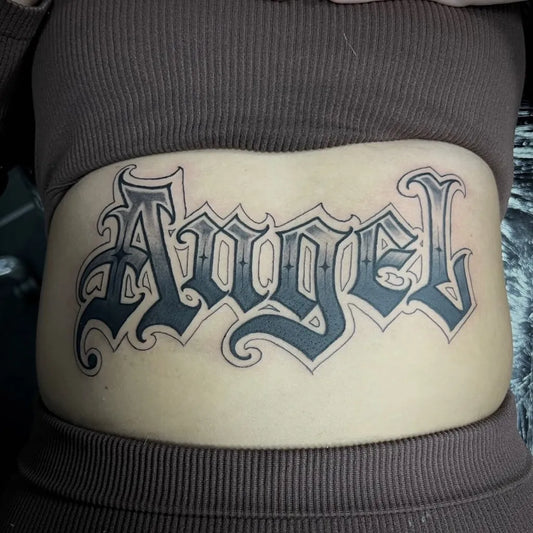 Medium Blackwork Angel Word Tattoo on Women Stomach by @blstcustom