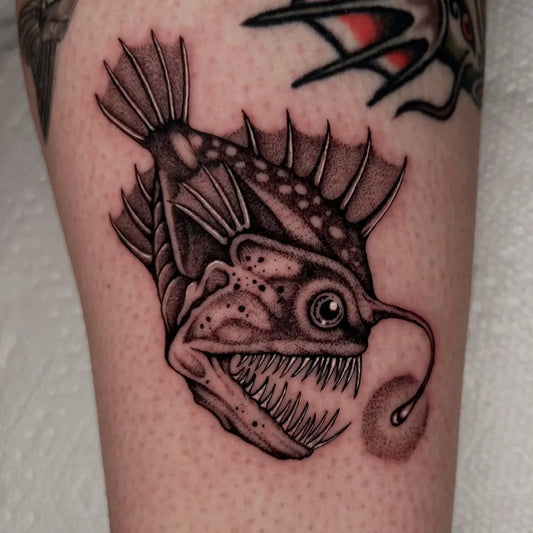 Medium Blackwork Anglerfish Tattoo on Men Arm by @ohshitsick