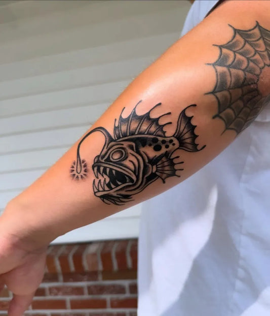 Medium Blackwork Anglerfish Tattoo on Men Arm by @scquilly