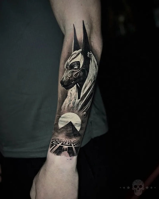 Medium Blackwork Anubis Pyramid Sun Tattoo on Men Arm by @crafttattoomaidstone