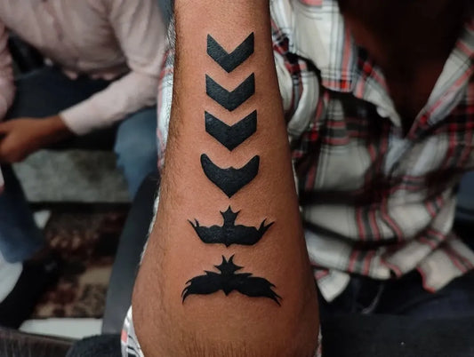 Medium Blackwork Arrow Design Tattoo on Men Arm by @shivansh_tattoo_piercing