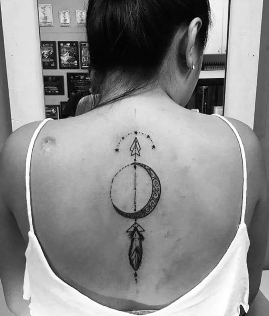 Medium Blackwork Arrow Moon Feather Tattoo on Women Back by @jello_t