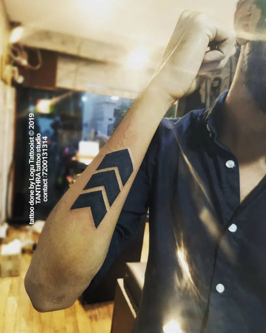 Medium Blackwork Arrow Tattoo on Men Arm by @tantra_tattoo_tamilnadu