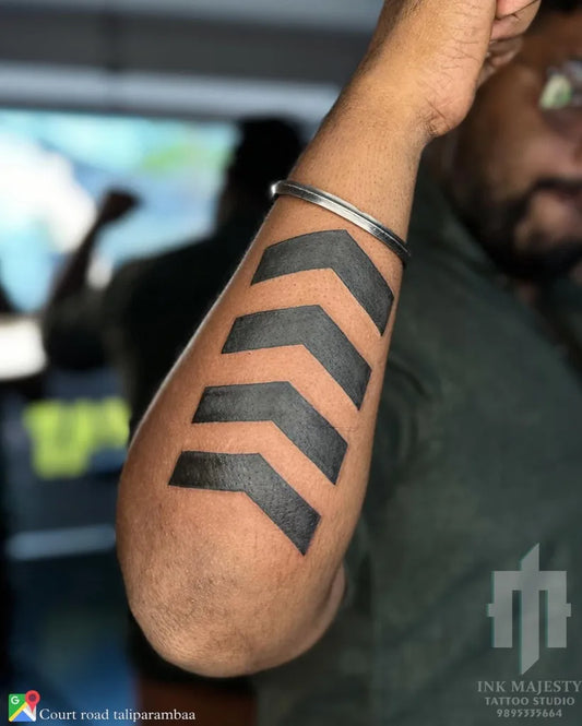 Medium Blackwork Arrow Tattoo on Men Arm by @tattoo_ink_majesty_taliparamba