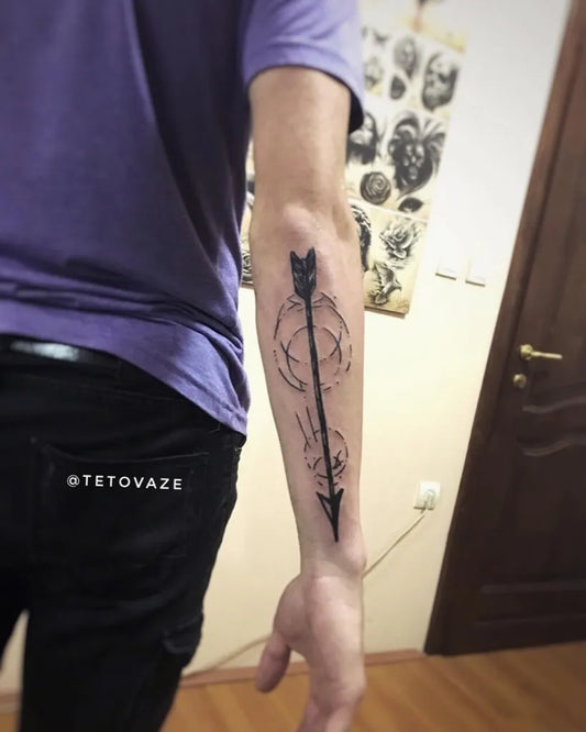 Medium Blackwork Arrow Tattoo on Men Forearm by @tetovaze