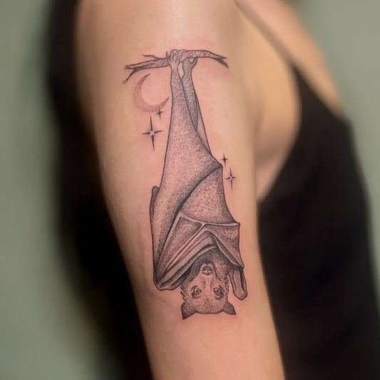 Medium Blackwork Bat Hanging from Branch with Moon and Stars Tattoo on Women Arm by @chloe.tatts
