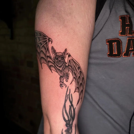 Medium Blackwork Bat Tattoo on Men Arm by @inkhaven_studio