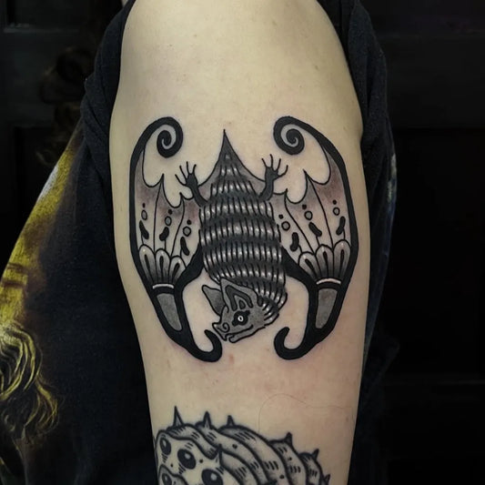 Medium Blackwork Bat Tattoo on Women Arm by @babyelletattoo