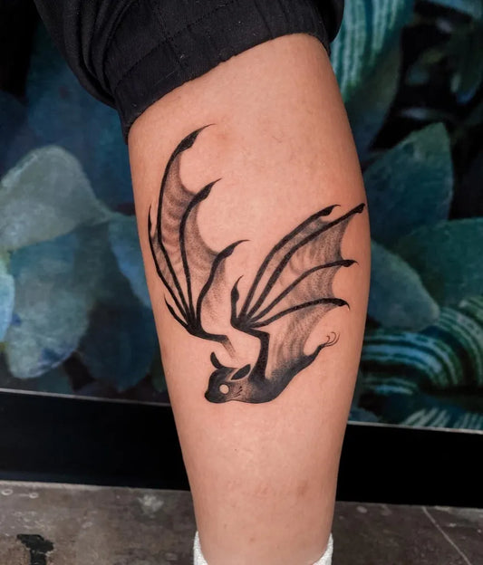 Medium Blackwork Bat Tattoo on Women Leg by @lyyons.ink