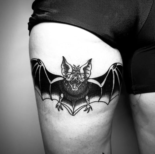 Medium Blackwork Bat Tattoo on Women Thigh by @ronttitatskaa