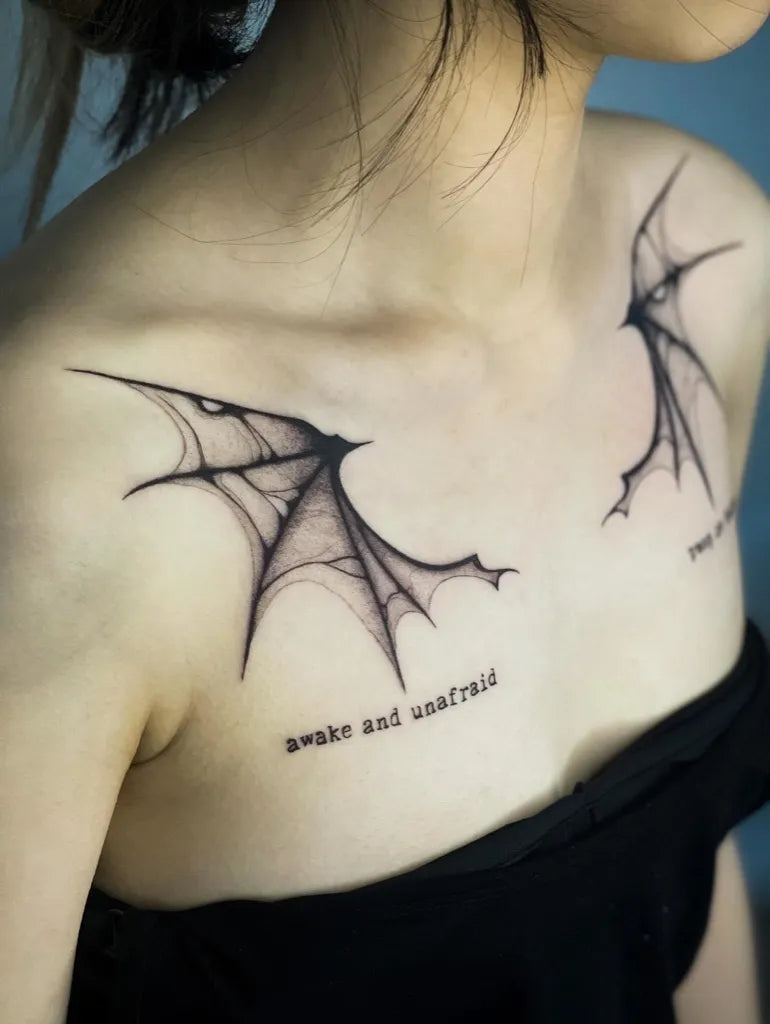 Medium Blackwork Bat Wings Tattoo on Women Shoulder by @grieg_tattoo
