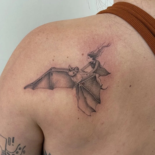 Medium Blackwork Bat and Girl Tattoo on Women Shoulder by @deecarl